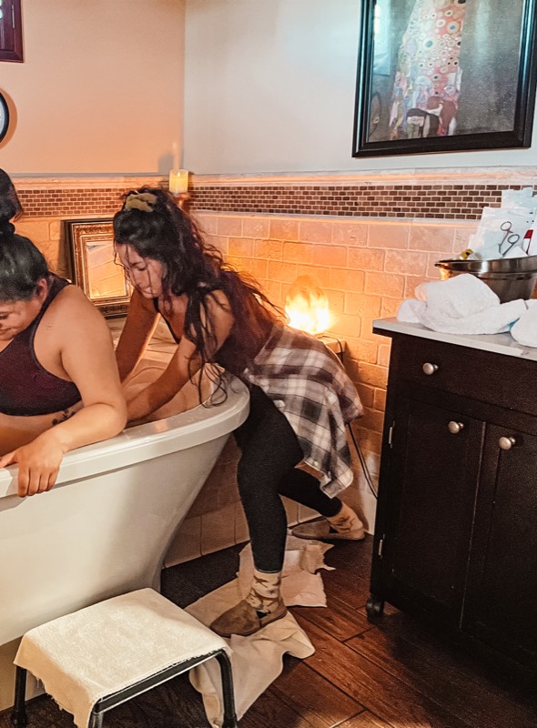 Juliana providing labor support during a water birth